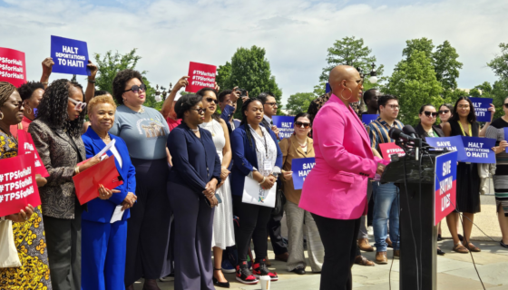 Members of Congress and leaders speaking at a press conference advocating for relief